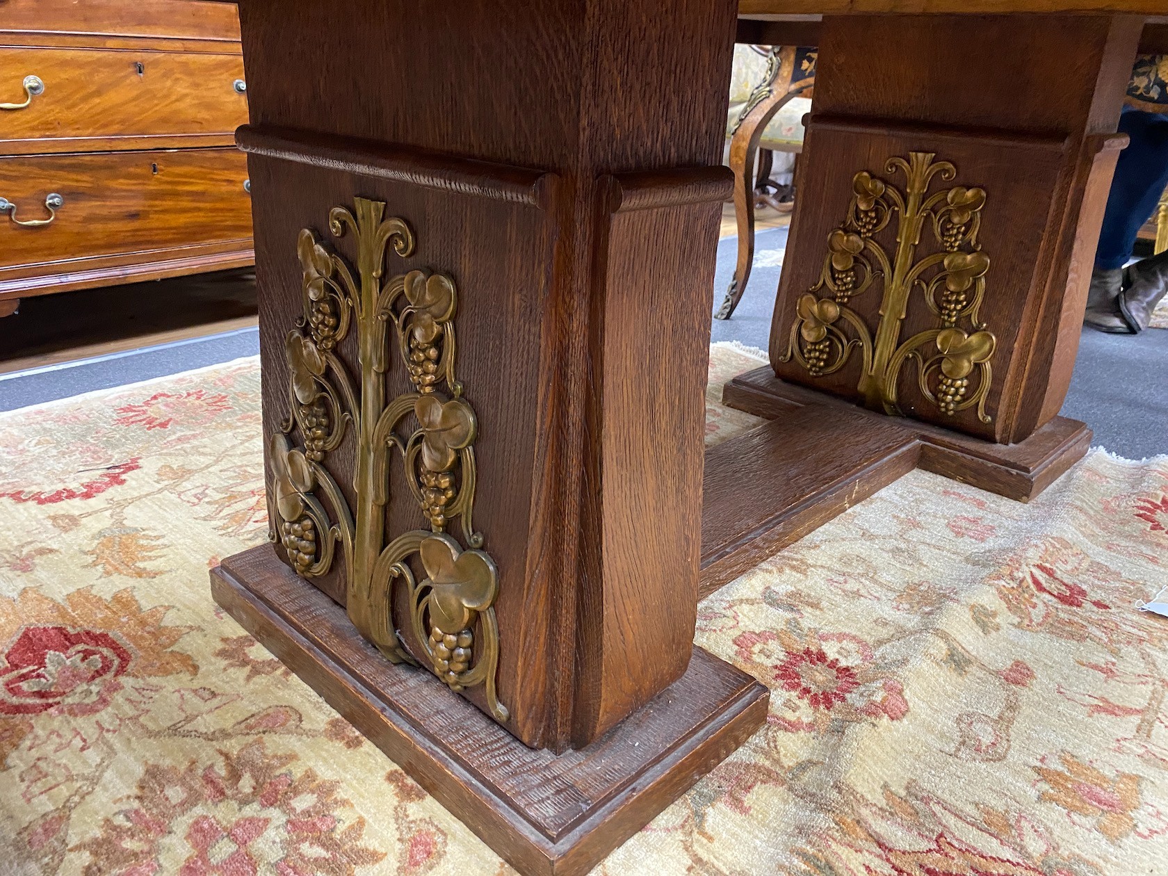 An early 20th century gilt bronze mounted rectangular oak dining table with cast fruiting vine decoration, width 180cm, depth 113cm, height 75cm
